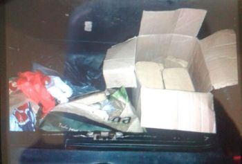 Droga foi encontrada em caixa de papelão dentro do porta-malas