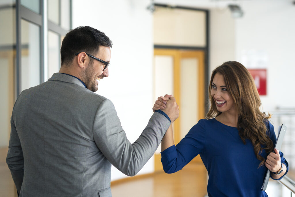 young successful business people greeting company s office