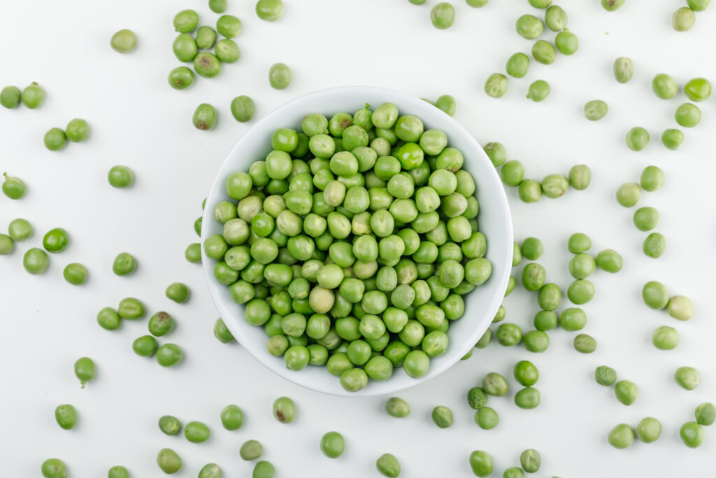 peas white bowl top view white wall