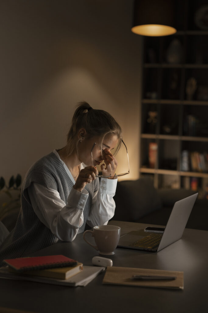 adult person working home computer night