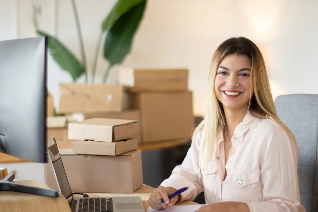 portrait shot happy female office worker looking camera smiling successful businesswoman working office success business youth concept