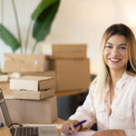 portrait shot happy female office worker looking camera smiling successful businesswoman working office success business youth concept