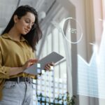 medium shot woman holding tablet 2