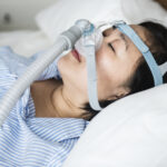 woman wearing anti snoring chin straps