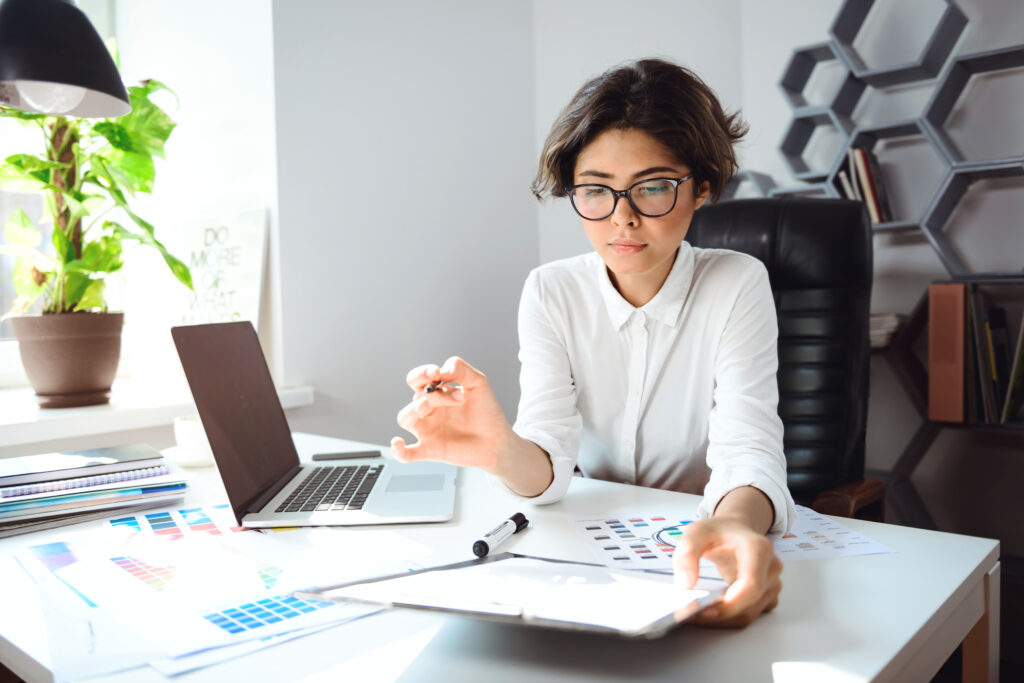 young beautiful businesswoman sitting workplace office