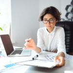 young beautiful businesswoman sitting workplace office