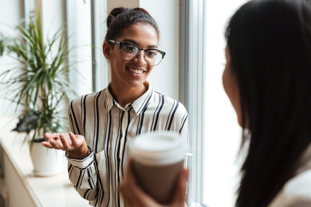 businesswomen colleagues talking with each other 1