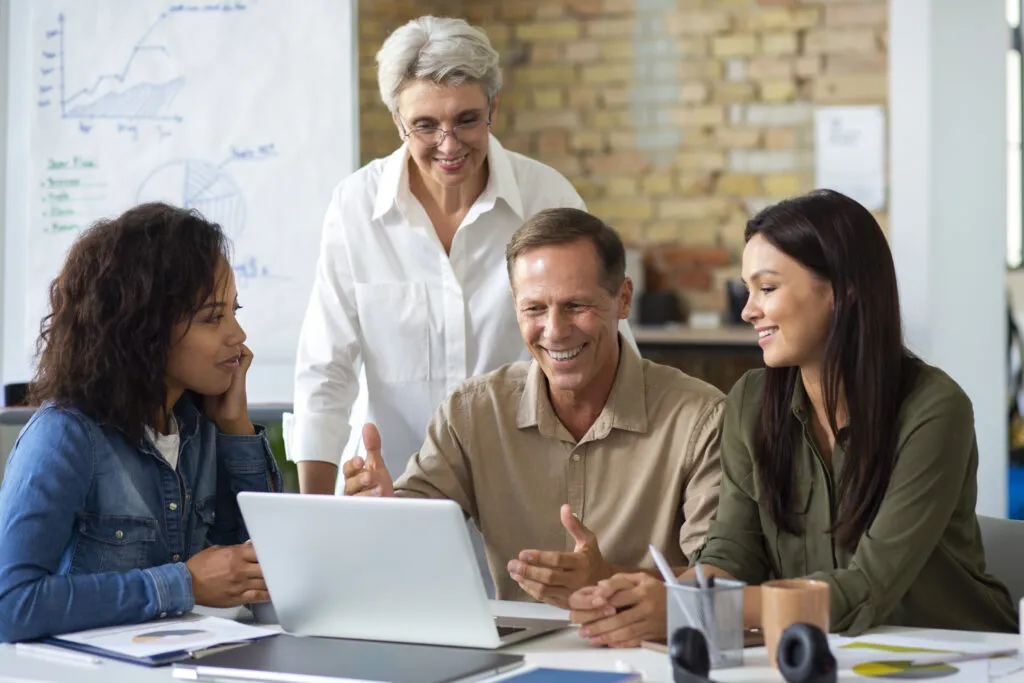 people using digital device while meeting