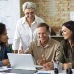 people using digital device while meeting