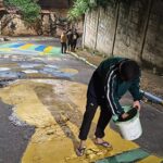 Universitários resgatam tradição das ruas pintadas para a Copa do Mundo em cidade mineira